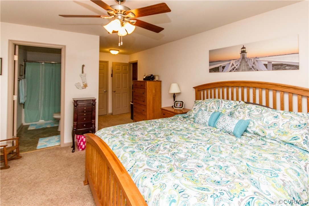 1101 Covington Road Colonial Heights, VA 23834 - Photo 22 of 47 a bedroom with a bed dresser and a large mirror