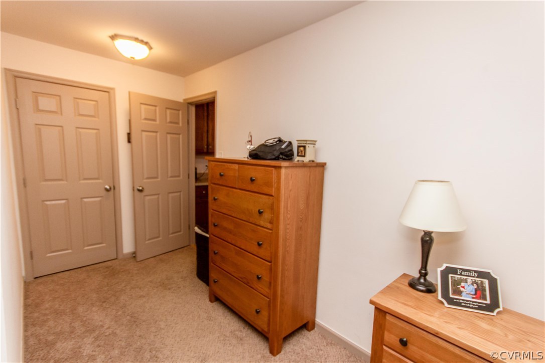 1101 Covington Road Colonial Heights, VA 23834 - Photo 24 of 47 a bed room with a bed and a lamp