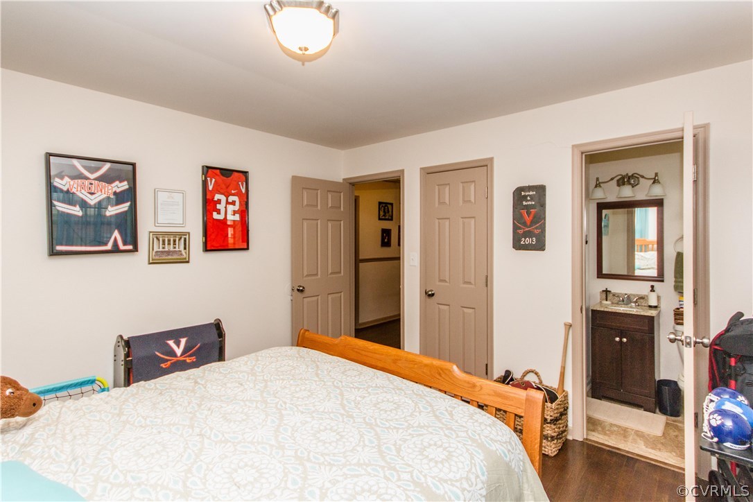 1101 Covington Road Colonial Heights, VA 23834 - Photo 30 of 47 a bedroom with a bed and a chandelier
