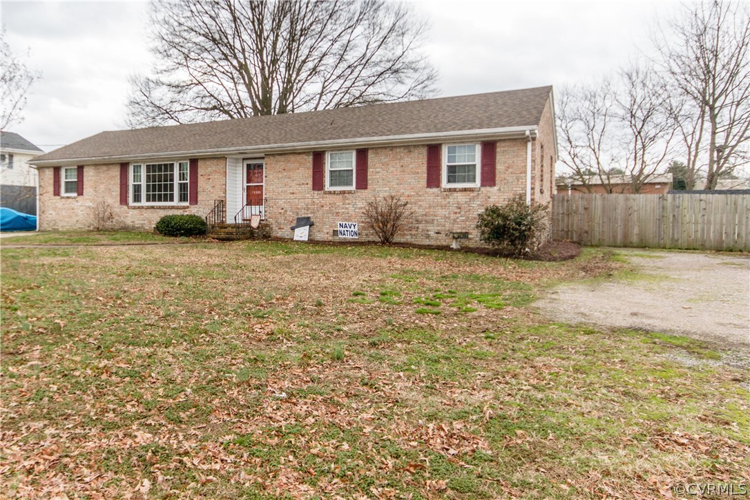 1101 Covington Road Colonial Heights, VA 23834 - Photo 3 of 47 a front view of a house with a garden