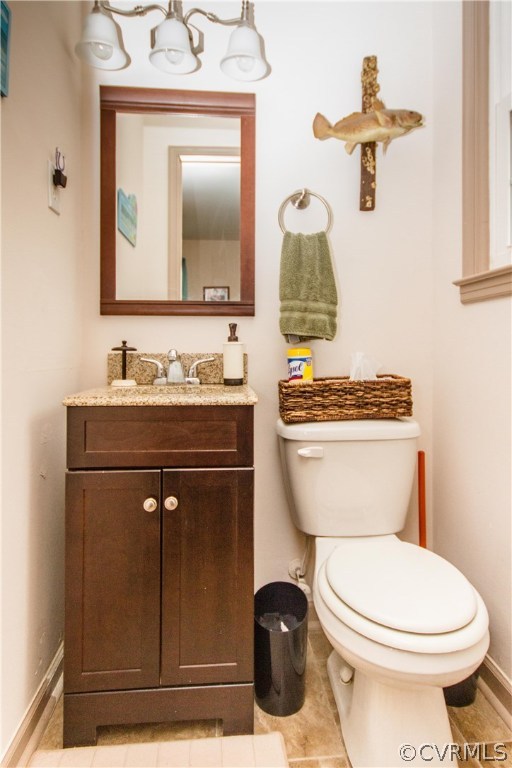 1101 Covington Road Colonial Heights, VA 23834 - Photo 32 of 47 a bathroom with a toilet a sink and mirror
