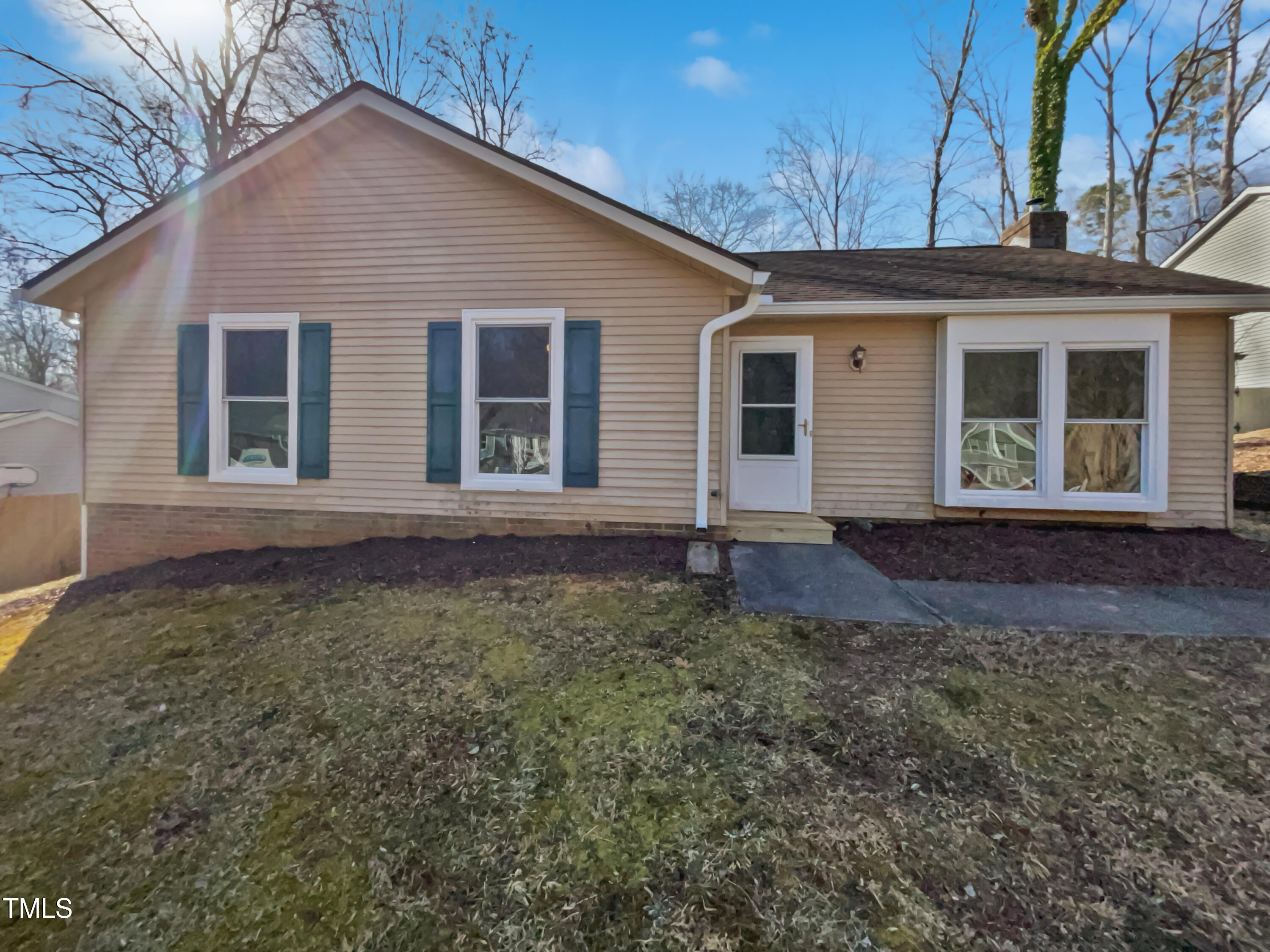 front view of a house with a yard