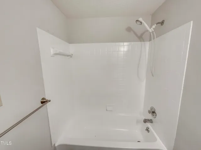 a close view of a bathtub in bathroom