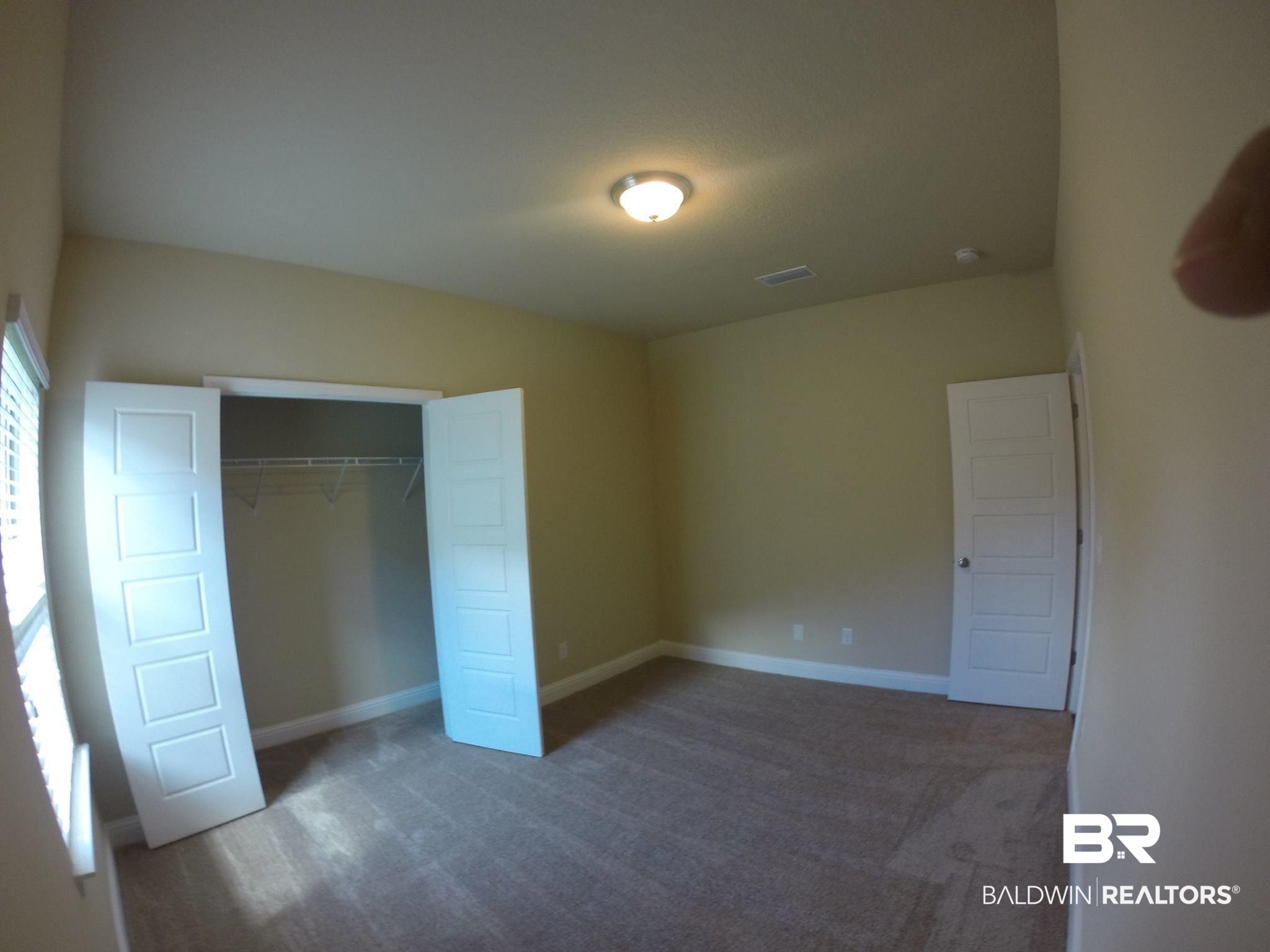 2996 Notsram Court Mobile, AL 36695 - Photo 10 of 16 Unfurnished bedroom with carpet, visible vents, a closet, and baseboards