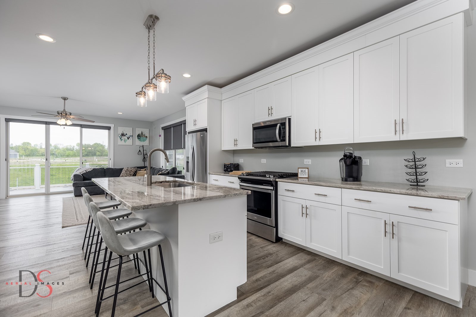 28 Waterside Way Ottawa, IL 61350 - Photo 12 of 29 a kitchen with stainless steel appliances granite countertop a sink a stove a refrigerator cabinets and chairs