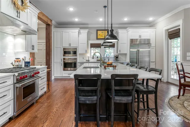 a view of a hallway with furniture and a livingroom