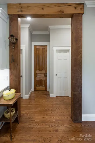 a view of a room with wooden floor