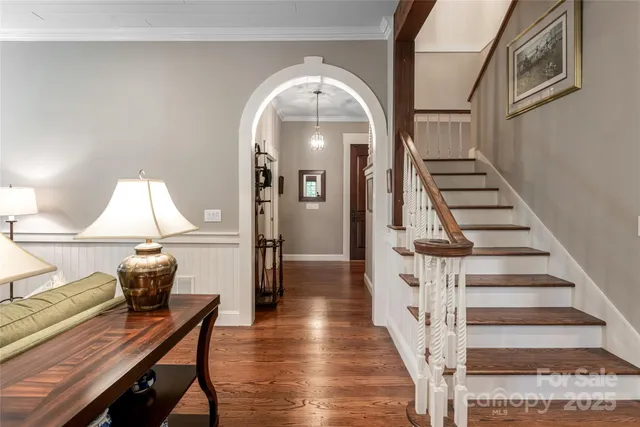 a bathroom with a granite countertop sink mirror bathtub and toilet