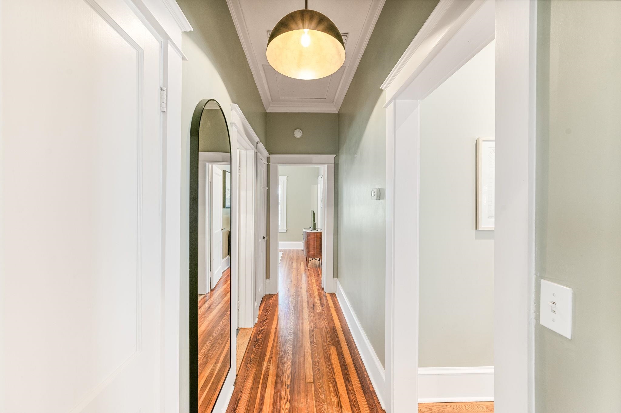 20 Riberia Street St. Augustine, FL 32084 - Photo 22 of 56 a view of a hallway with wooden floor and lamp