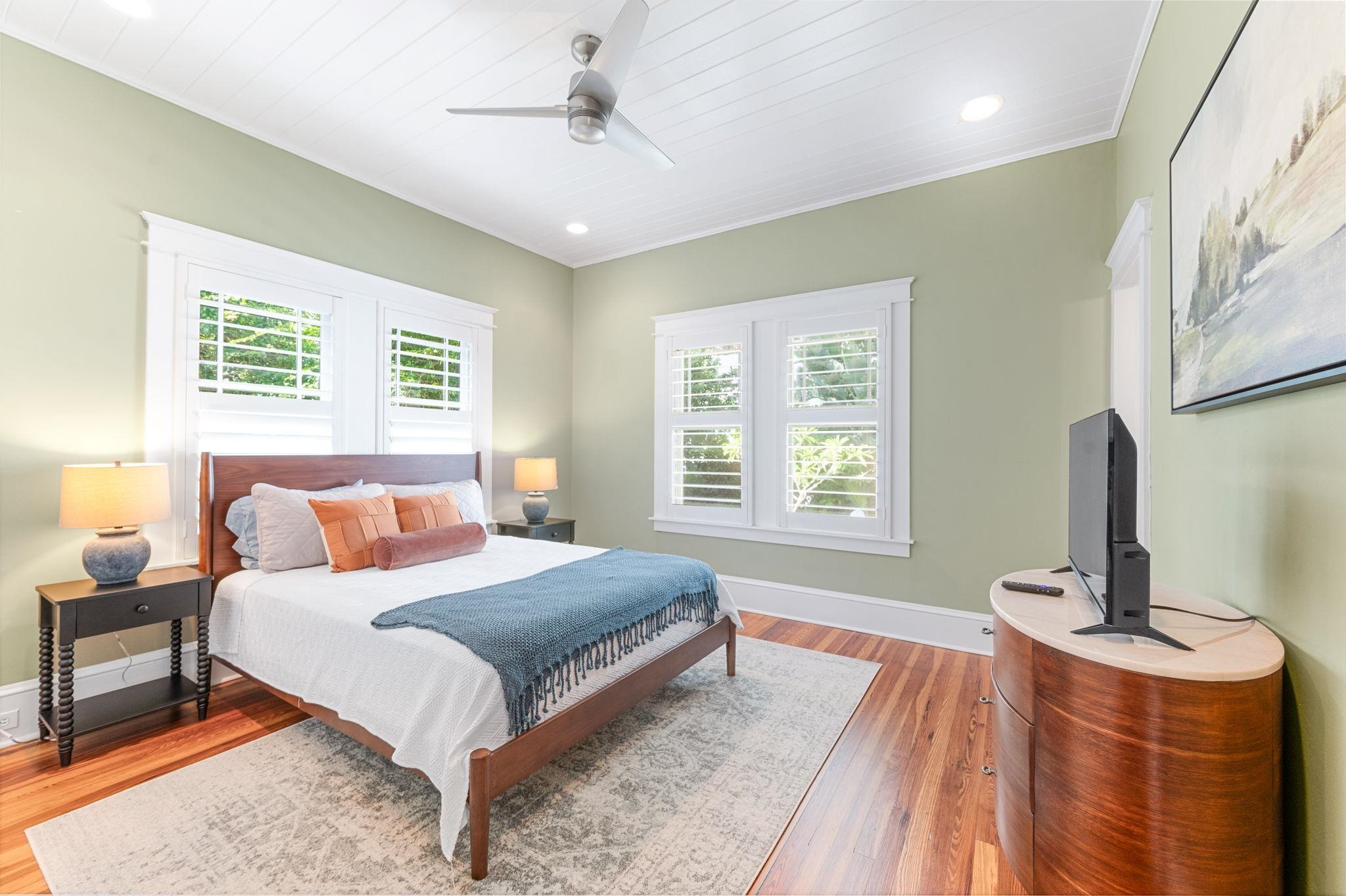 20 Riberia Street St. Augustine, FL 32084 - Photo 23 of 56 a bedroom with a bed and a flat screen tv