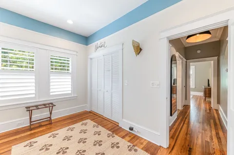 a living room with furniture and windows