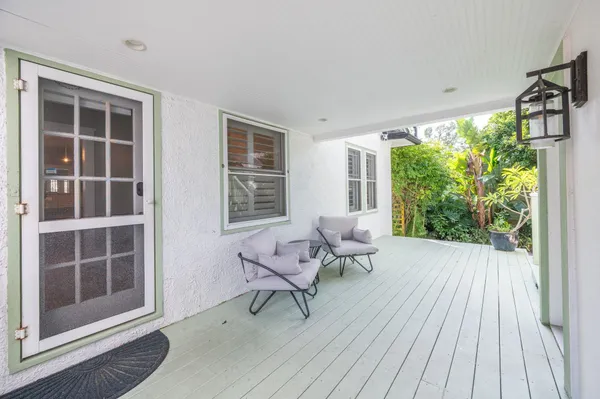 a view of balcony with wooden floor