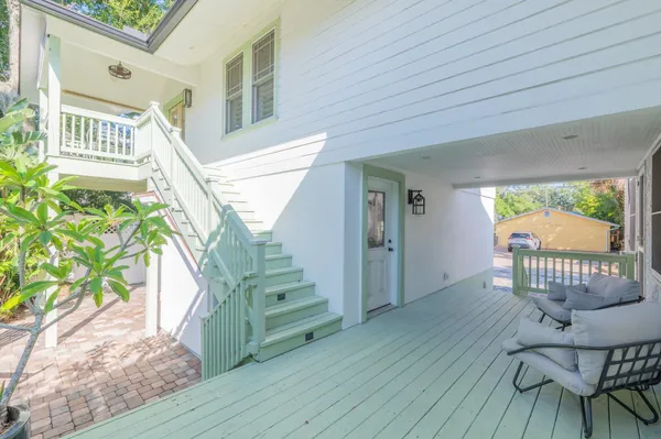 a living room with a couch and next to a window