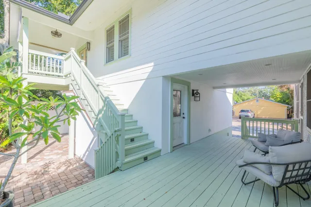 a living room with a couch and next to a window