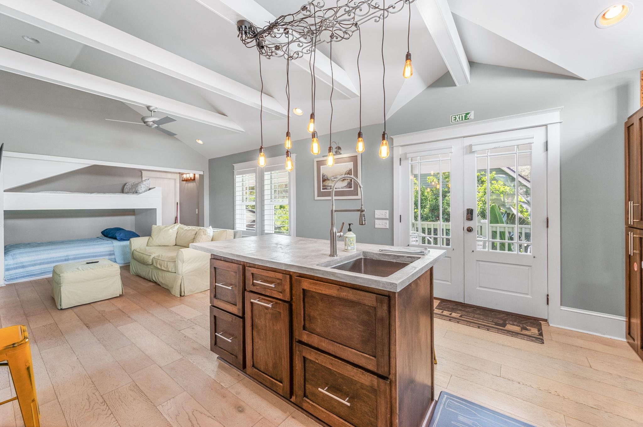 20 Riberia Street St. Augustine, FL 32084 - Photo 36 of 56 a kitchen with a sink and wooden floor