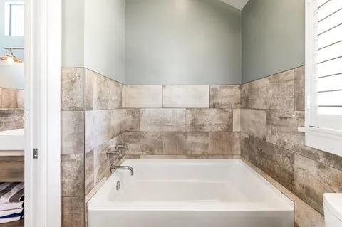 a view of a patio with table and chairs and potted plants