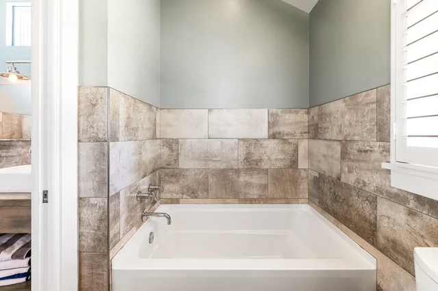 a view of a patio with table and chairs and potted plants