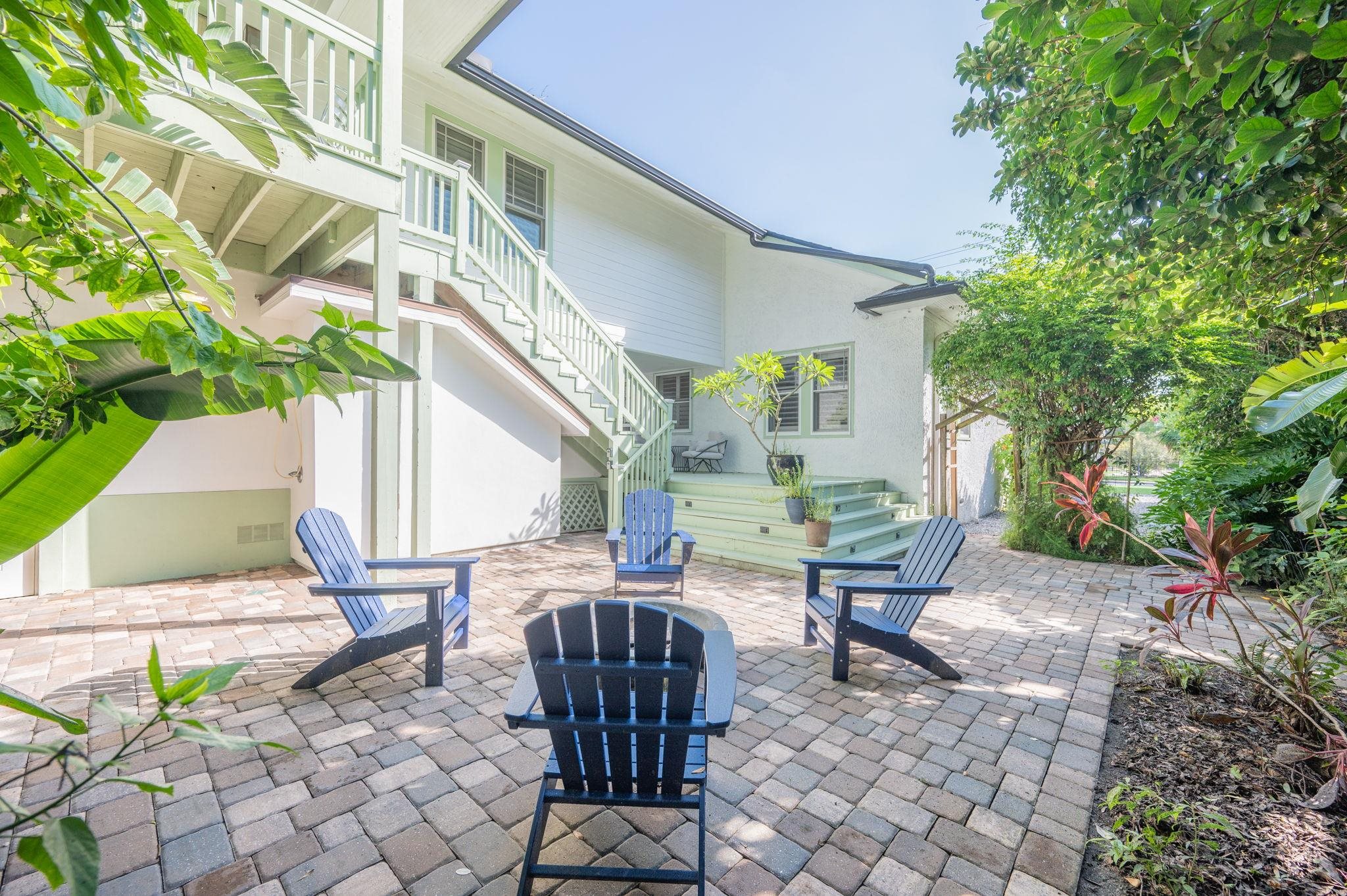 20 Riberia Street St. Augustine, FL 32084 - Photo 47 of 56 a view of a patio with table and chairs and potted plants