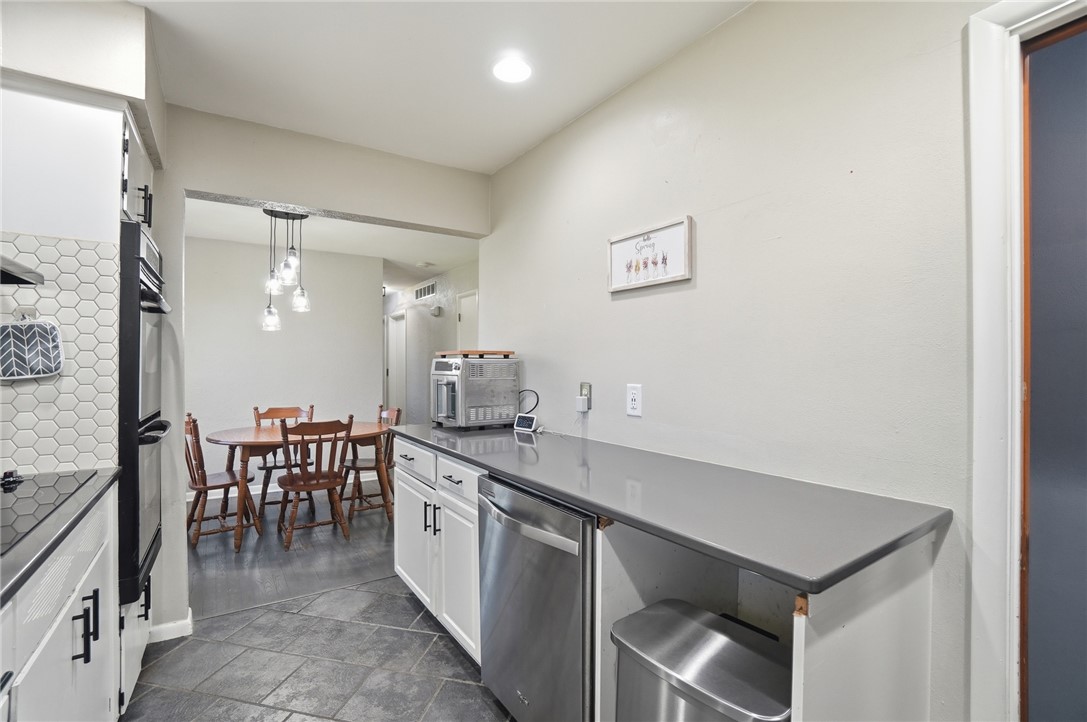 1325 Chelsea Road Troy, OH 45373 - Photo 16 of 42 This functional kitchen seamlessly connects to a dining area, perfect for daily meals.