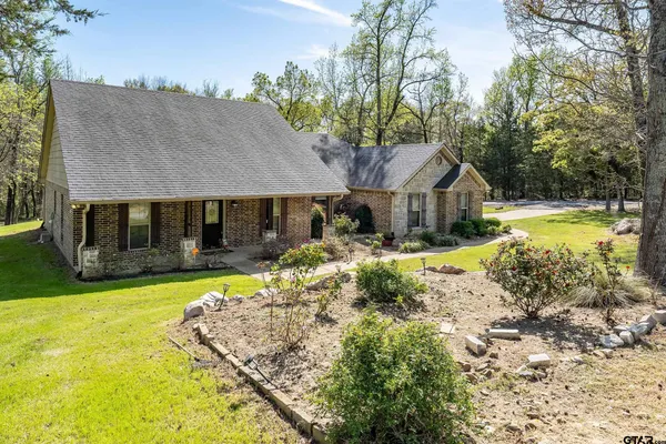 a view of a house with pool and a yard view