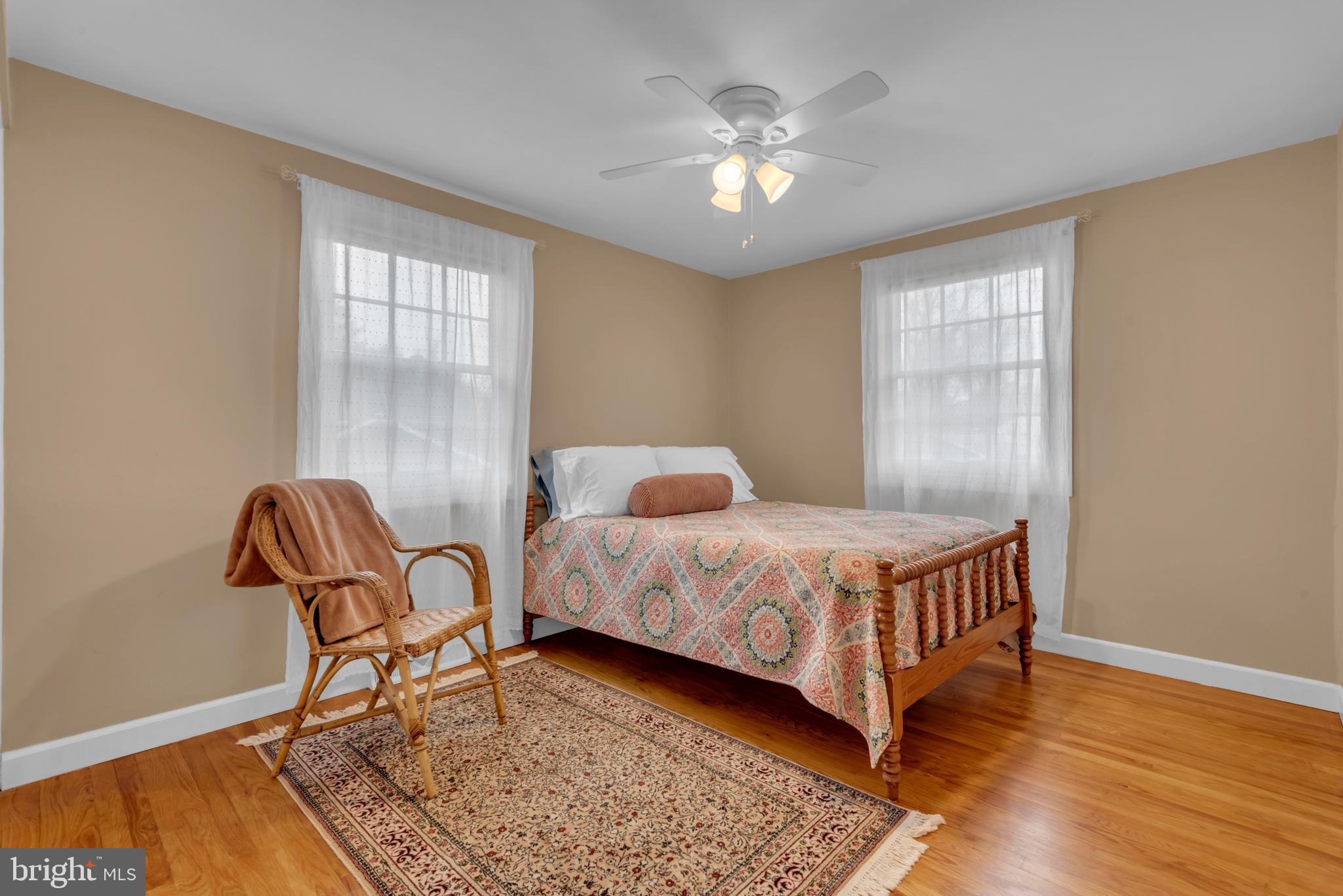 5 Spring Haven Court Severna Park, MD 21146 - Photo 22 of 35 a bedroom with a bed chair and a window