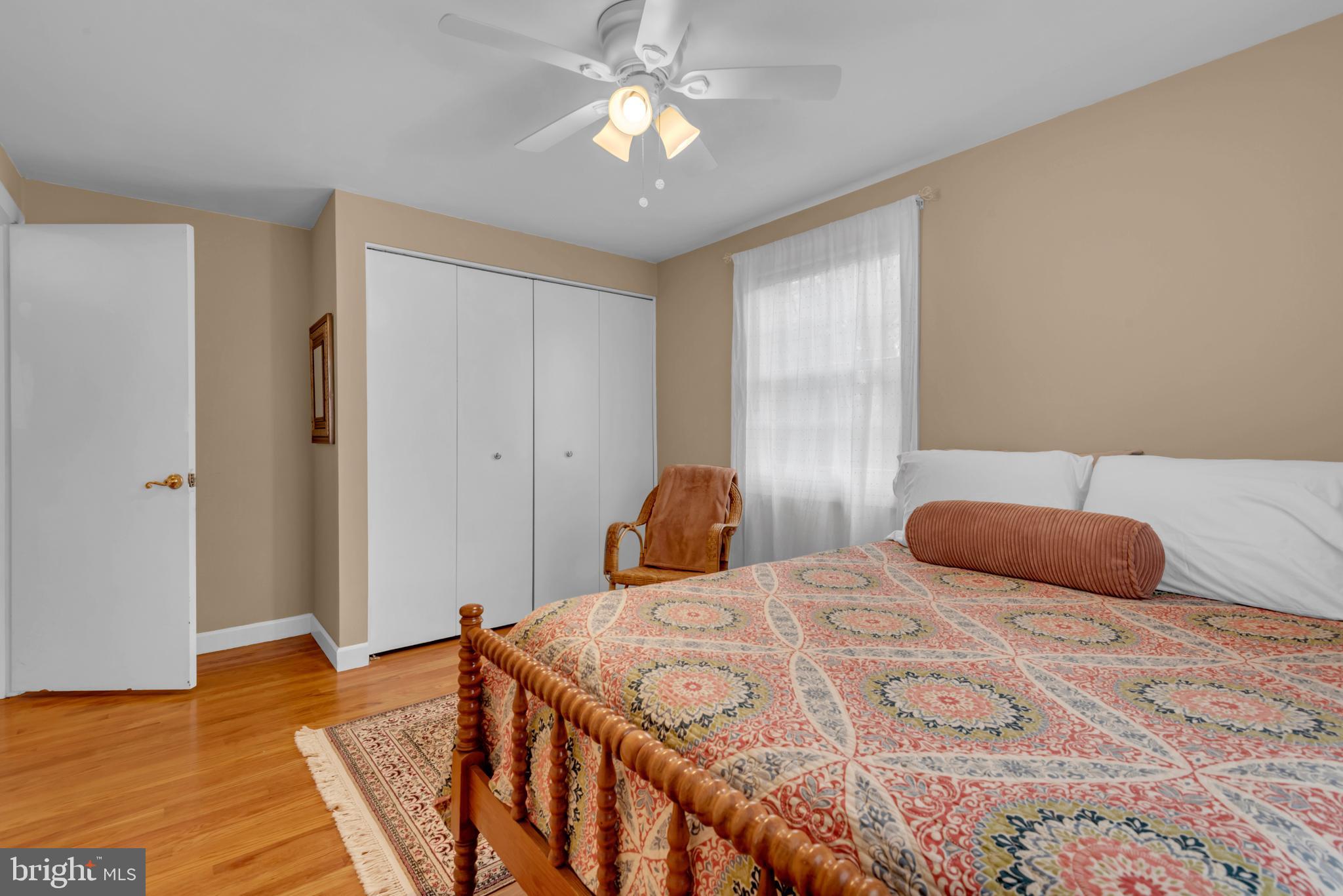 5 Spring Haven Court Severna Park, MD 21146 - Photo 23 of 35 a bedroom with a bed and a chandelier