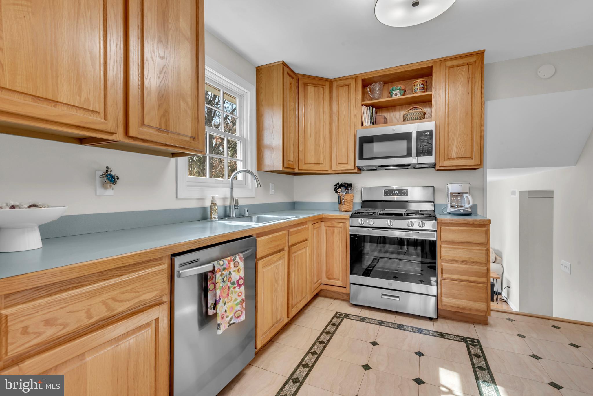5 Spring Haven Court Severna Park, MD 21146 - Photo 10 of 35 a kitchen with stainless steel appliances granite countertop a stove a sink and a microwave