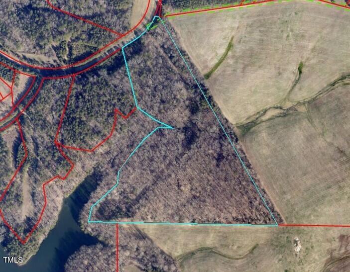 17.03-ac New Mayo Drive Roxboro, NC 27574 - Photo 13 of 14 a view of a backyard