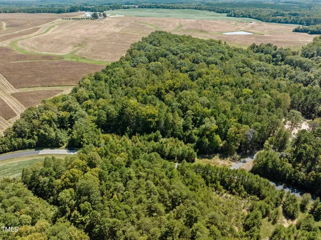 a view of a garden with a building