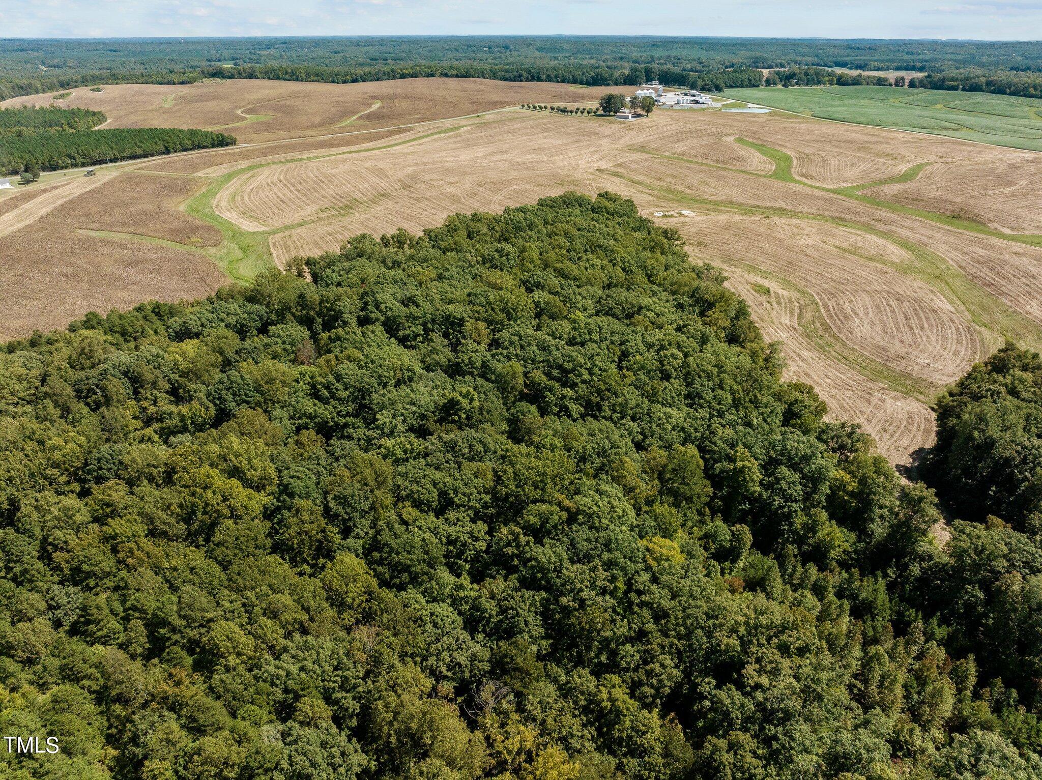 17.03-ac New Mayo Drive Roxboro, NC 27574 - Photo 8 of 14 a view of an ocean and beach
