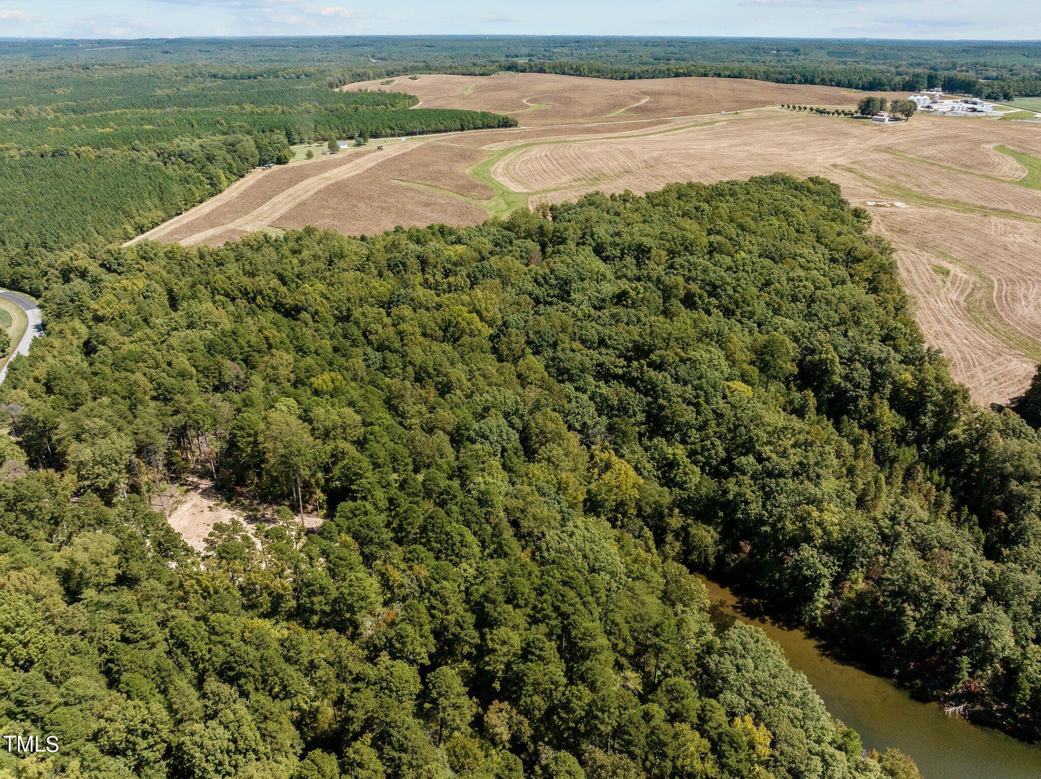 17.03-ac New Mayo Drive Roxboro, NC 27574 - Photo 9 of 14 a view of an ocean from a beach