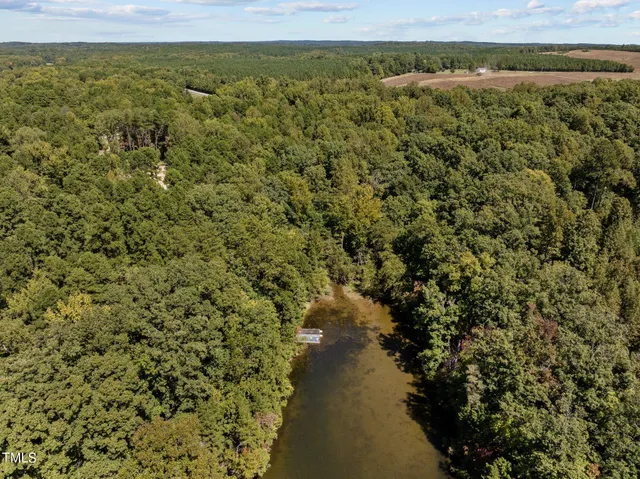 a view of a lake with a building in the background