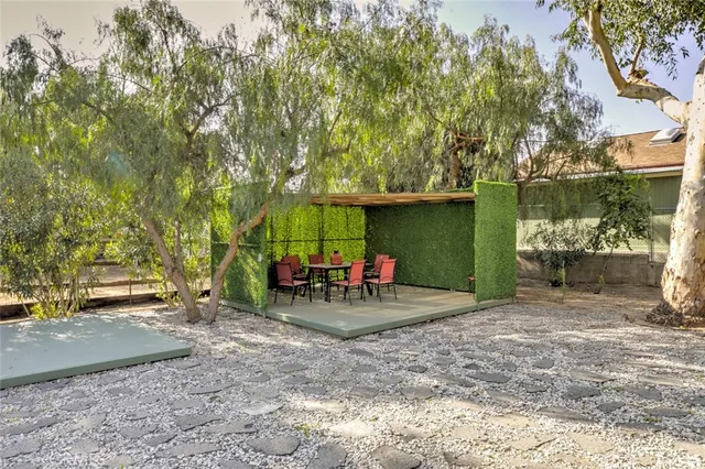 a spacious bedroom with a bed and wooden floor