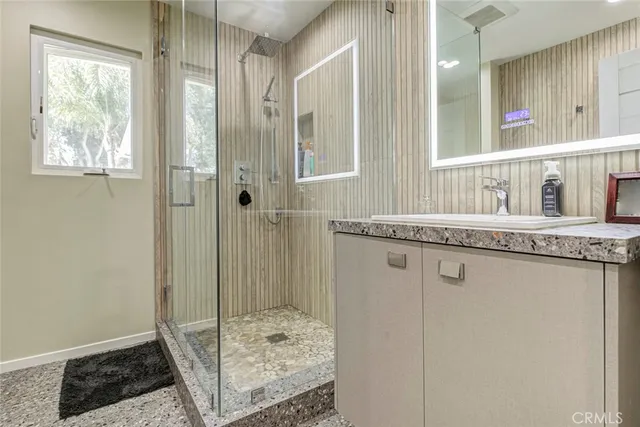 a view of a livingroom with furniture wooden floor and a rug
