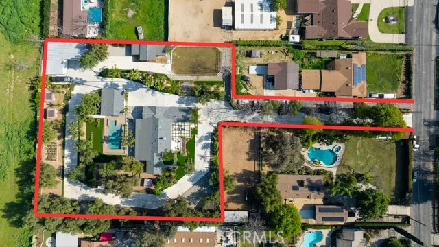 a bathroom with a granite countertop sink a mirror and shower