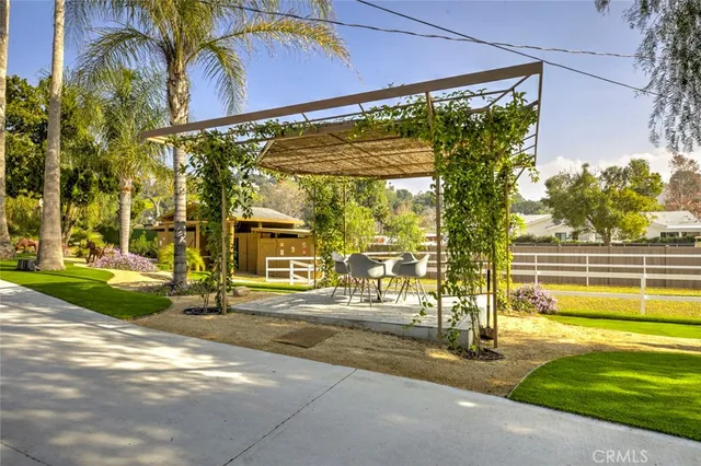 a kitchen with stainless steel appliances granite countertop a stove cabinets and wooden floor
