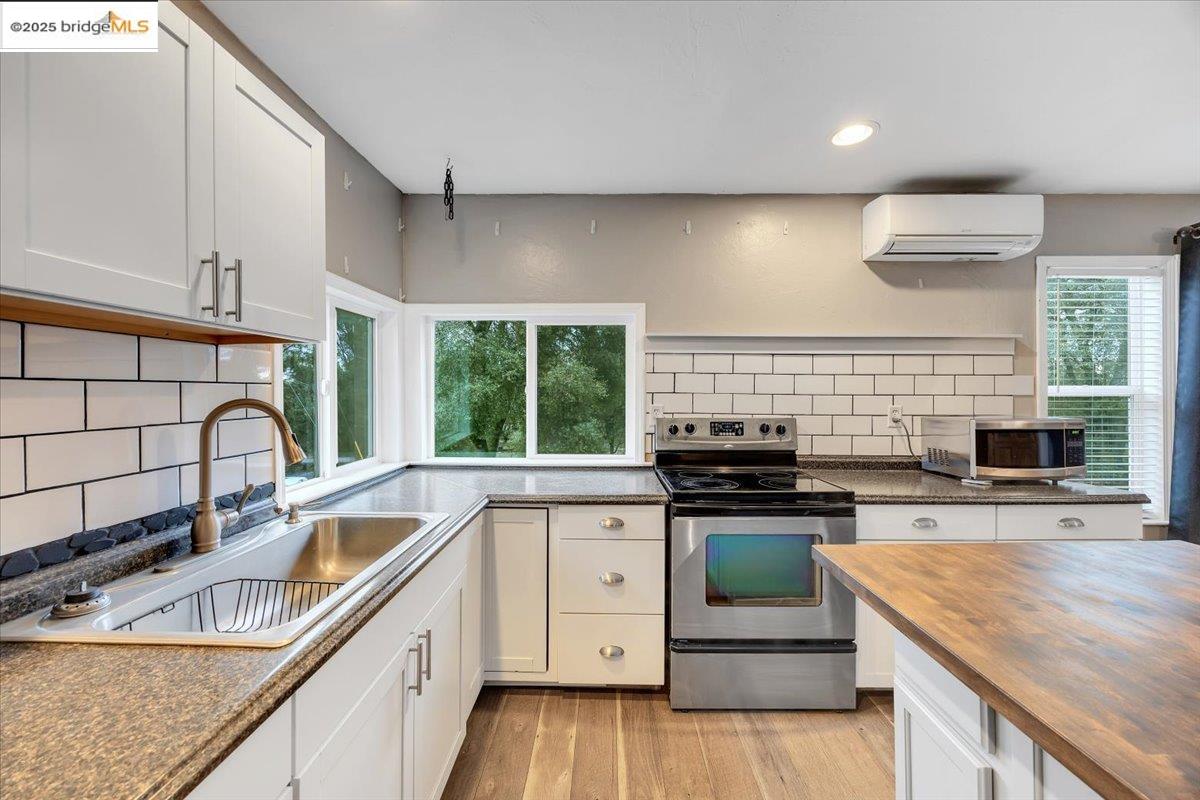 21980 Montgomery Road Sonora, CA 95370 - Photo 14 of 52 a kitchen with a stove sink and microwave