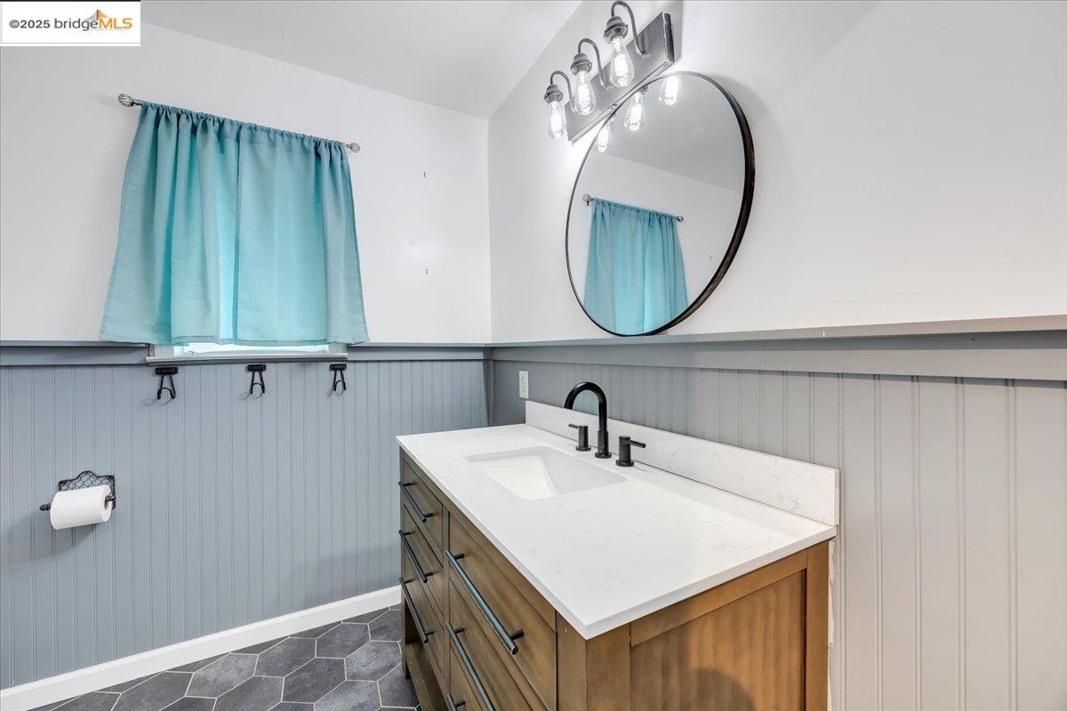 21980 Montgomery Road Sonora, CA 95370 - Photo 19 of 52 a bathroom with a sink and a mirror