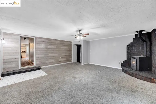 a bedroom with bed and a chandelier