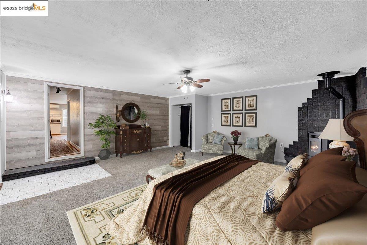 21980 Montgomery Road Sonora, CA 95370 - Photo 22 of 52 a bedroom with bed and a chandelier