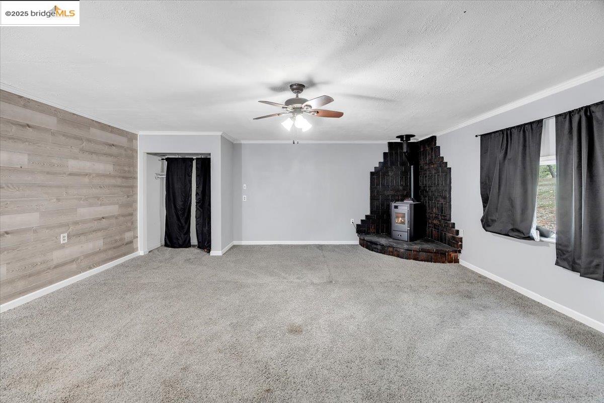 21980 Montgomery Road Sonora, CA 95370 - Photo 24 of 52 an empty room with closet and a ceiling fan