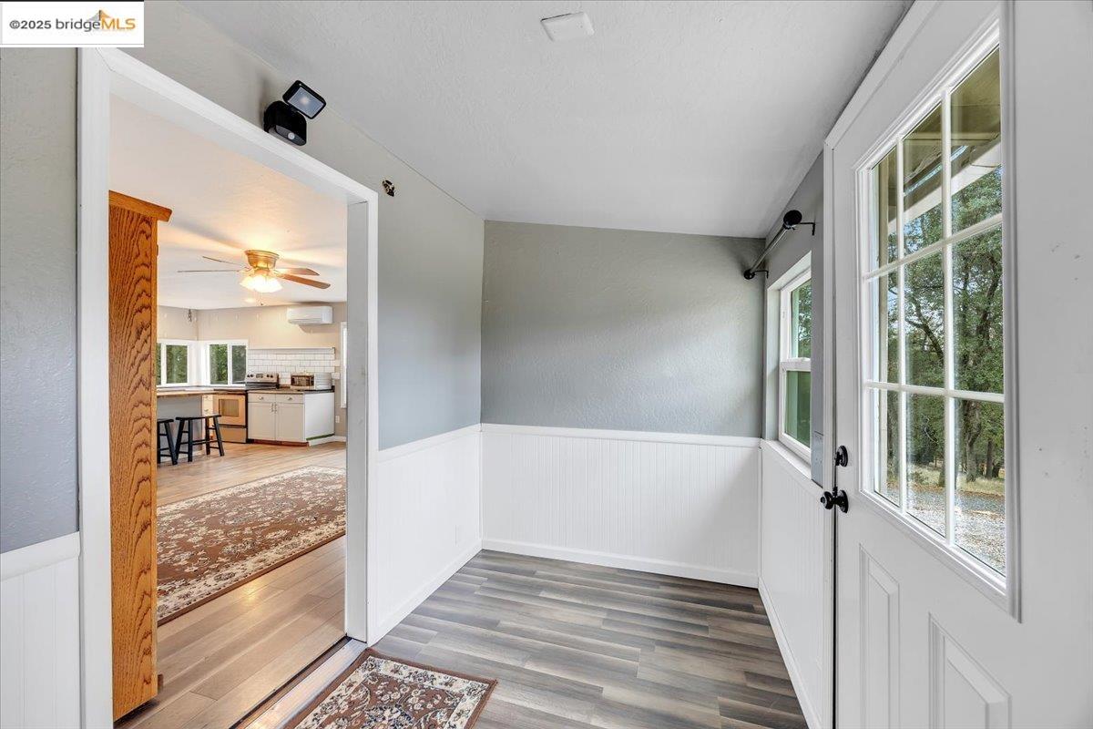 21980 Montgomery Road Sonora, CA 95370 - Photo 27 of 52 Entryway with a wainscoted wall and wood finished floors