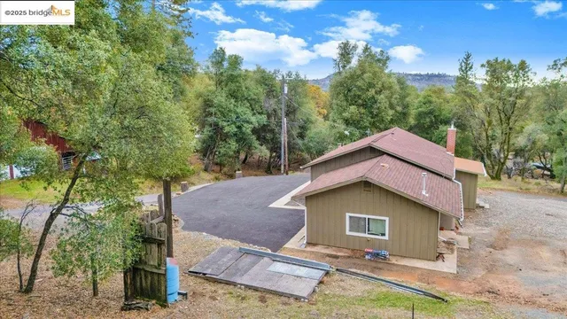 a house with trees in the background