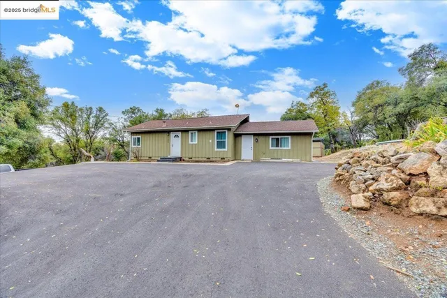 a view of house with outdoor space
