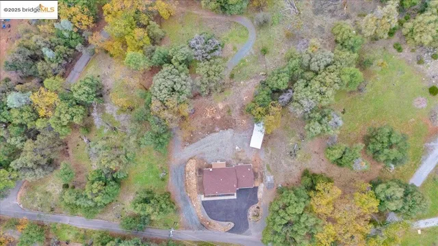 an aerial view of a houses with outdoor space