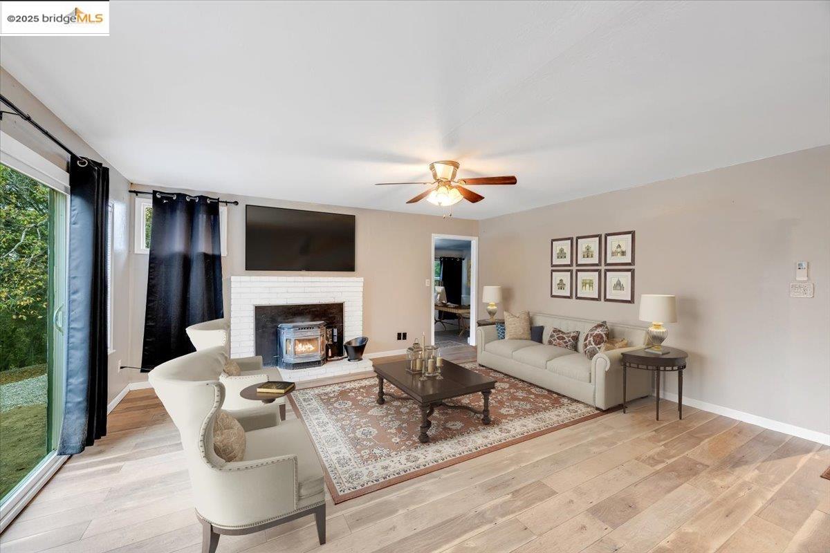 21980 Montgomery Road Sonora, CA 95370 - Photo 5 of 52 a living room with furniture and a fireplace