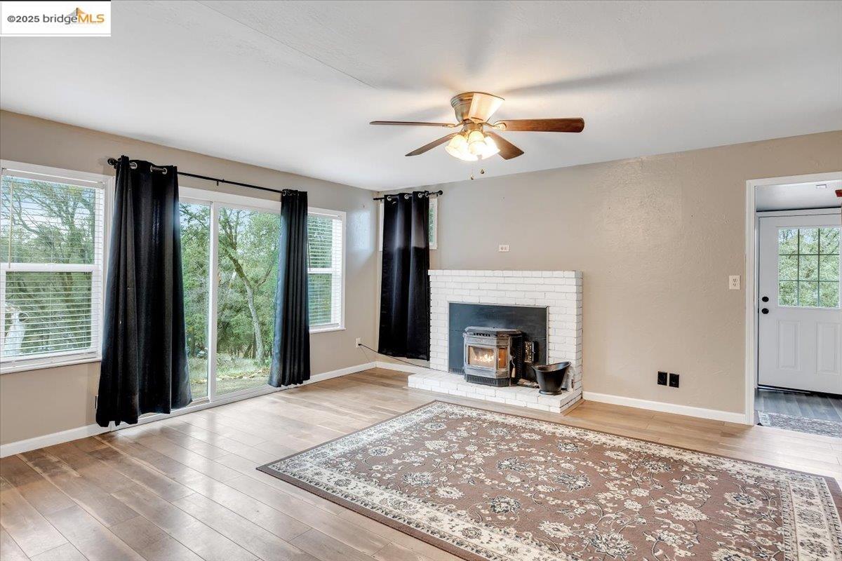 21980 Montgomery Road Sonora, CA 95370 - Photo 7 of 52 a view of an empty room with window and fire place