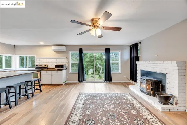 a view of a kitchen with a stove cabinets and a fireplace