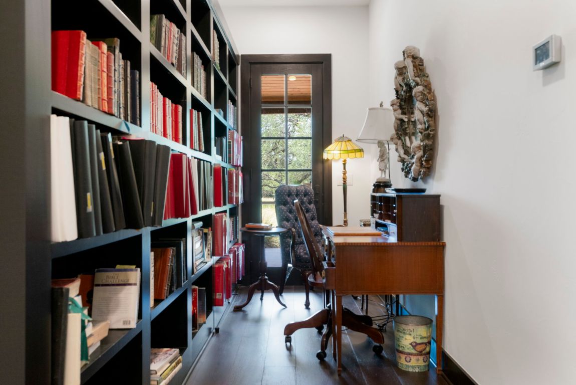 4073 Bell Springs Road Dripping Springs, TX 78620 - Photo 35 of 38 a view of a workspace with furniture and toys