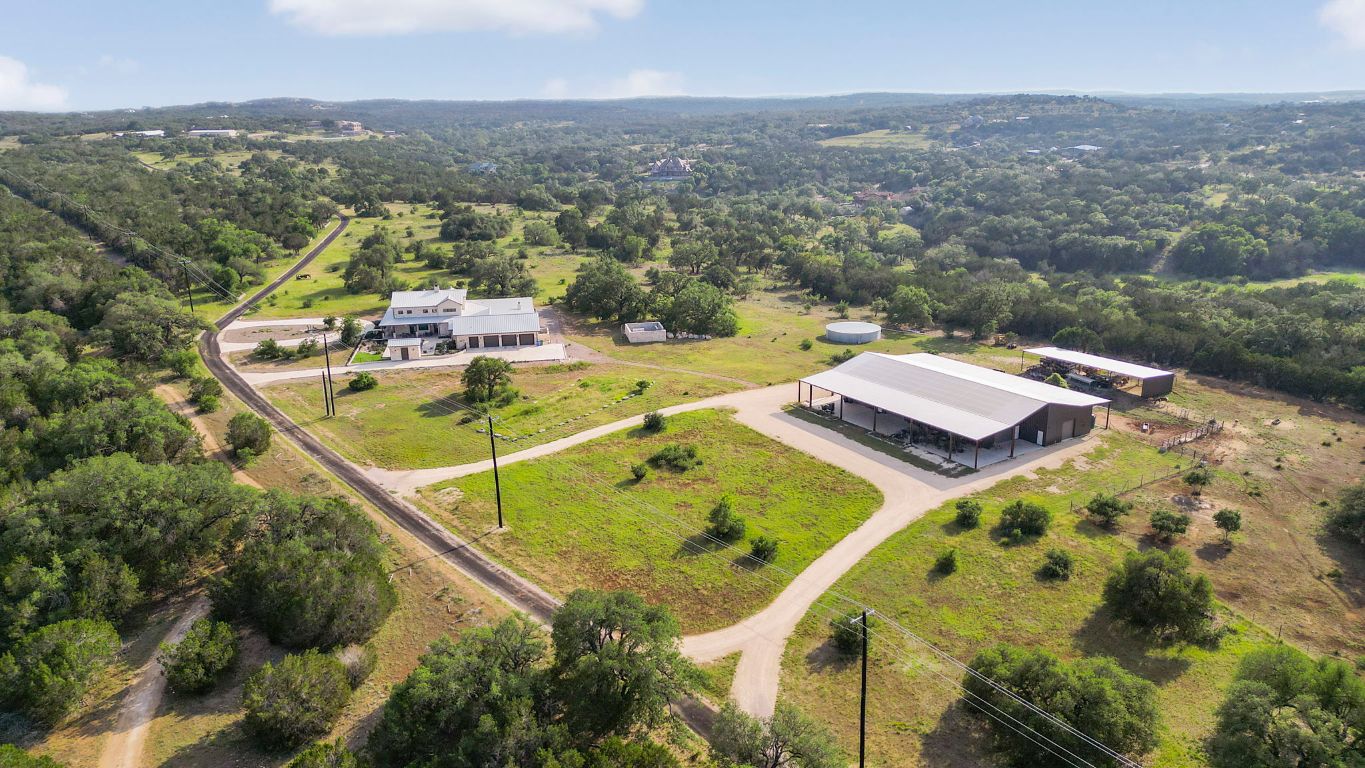 4073 Bell Springs Road Dripping Springs, TX 78620 - Photo 8 of 38 a view of a balcony with two chairs